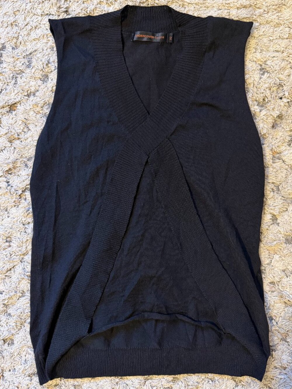Undercover Co. Ltd. by Jun Takahashi black sleeveless knit top